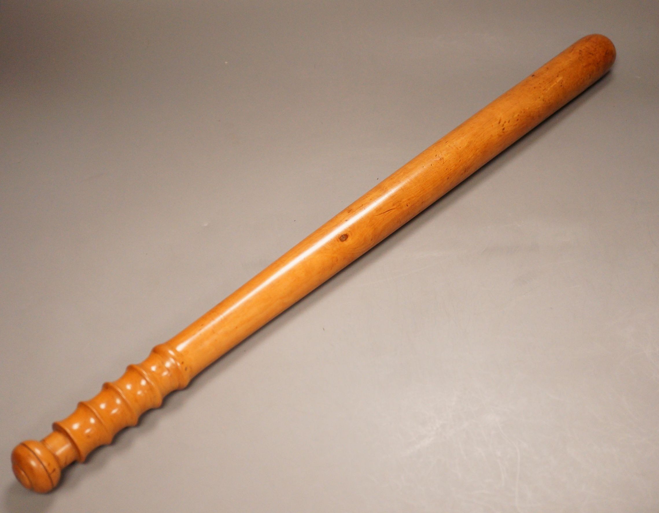 A large 19th century turned boxwood truncheon, stamped ‘Gonin’, 61cm